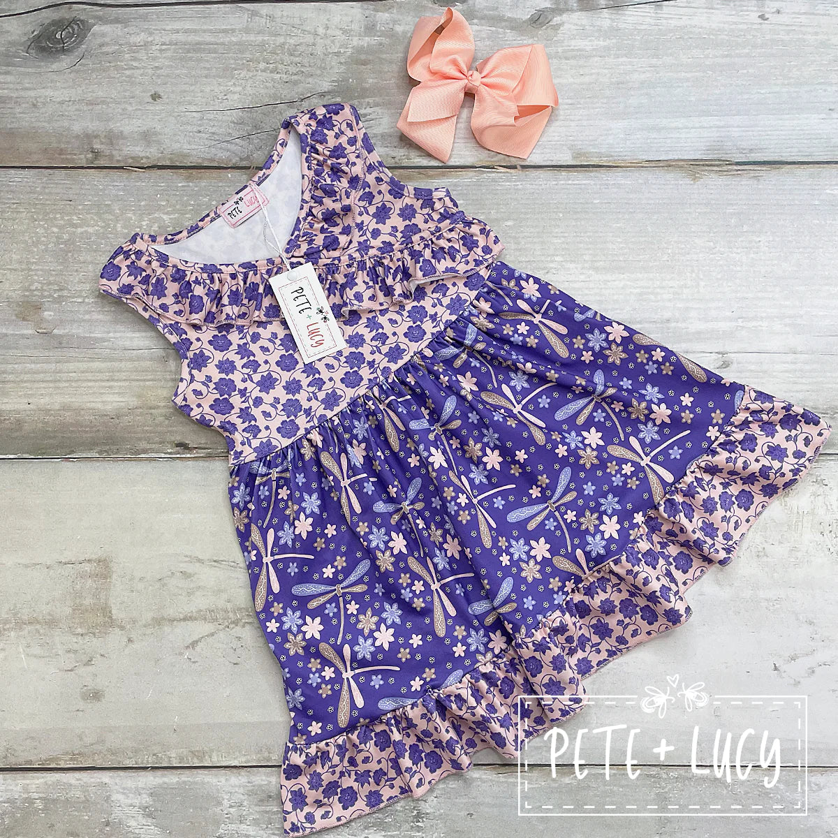 This adorable sleeveless dress is perfect for any occasion. We love the use of the dragonfly and floral print, the contrasting colors, and the sweet ruffle. on the chest and hem. A must for the wardrobe this season! Check out the sibling outfits in the matching fabric.