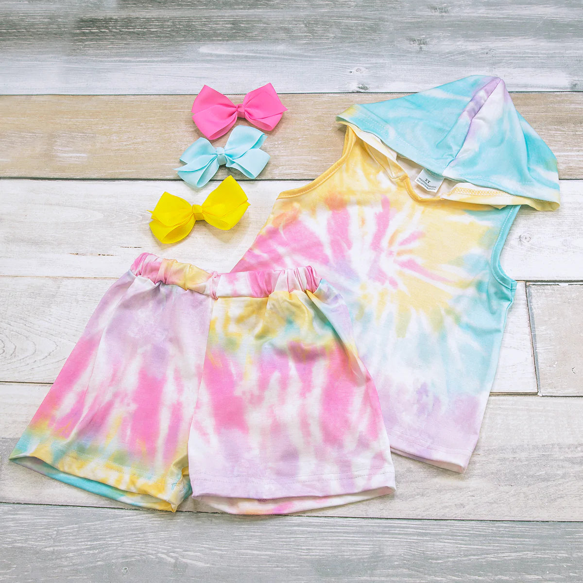Stylish and soft this super cute and comfy 2 piece hooded short set is a must have. The beautiful tie-die colors are so pretty and the elastic waist shorts and hooded top are on trend for the season!