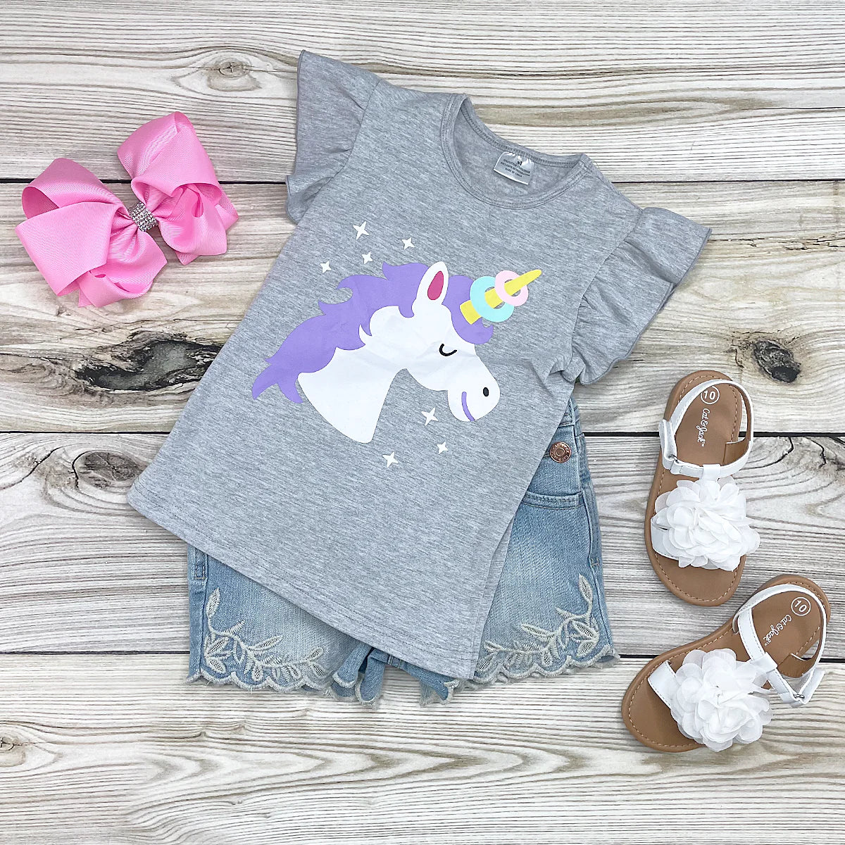 This Fun with Unicorns Ruffled Sleeve Shirt lets you make a statement with bright, vibrant graphics and playful ruffled sleeves. Made from soft, breathable fabric, this comfortable shirt is an ideal way to show off your love of fantasy. Add a touch of fun to any outfit with this stylish, fun piece of clothing.