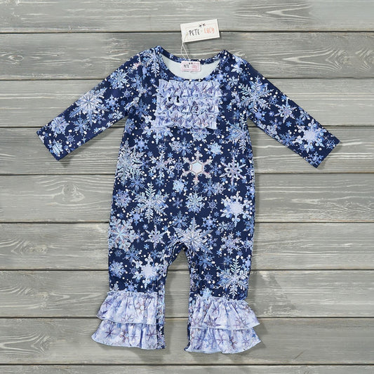 This Winter Family Girl's Romper will make your kiddo the cutest girl on the block! With a beautiful royal blue background and snowflake print in light blues and silver, plus double ruffle trim at the ankle, she'll be all set to sparkle for the holidays! Check out the entire matching family collection.