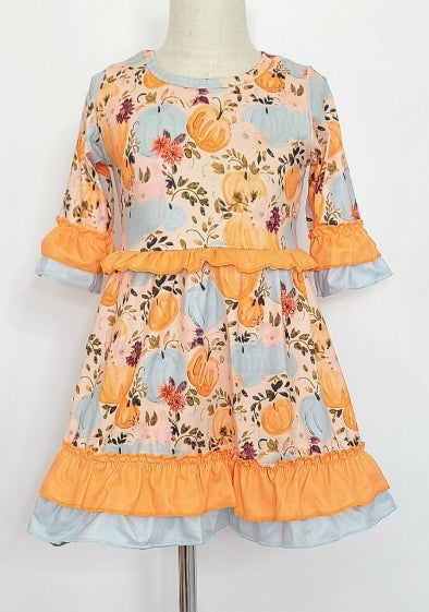 Our Melancholy Pumpkin Dress will have you 🎃in love! Featuring a vibrant floral and pumpkin design, with beautiful hues of oranges and blues, it's perfect for fall! The double ruffle on the sleeve and hem gives it an extra special touch - grab yours to take on those autumnal adventures! 🍂☀️