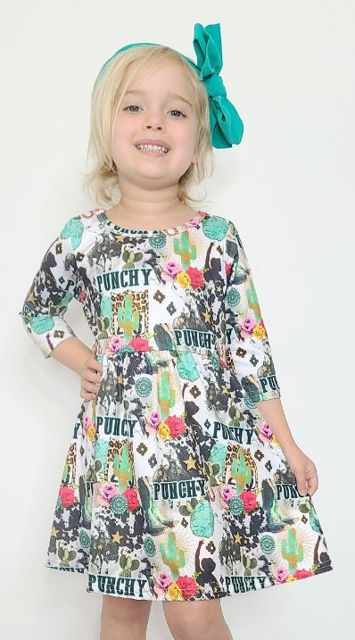 Be ready to look fabulous with this Punchy-Girl A-Line dress! Crafted from butter-soft cotton, this statement piece features a funky print including cactus, leopard and flowers for a wild yet chic look. The 3/4 sleeve and rounded neckline make it perfect for everyday styling! Rock a unique look in the wildest of prints!