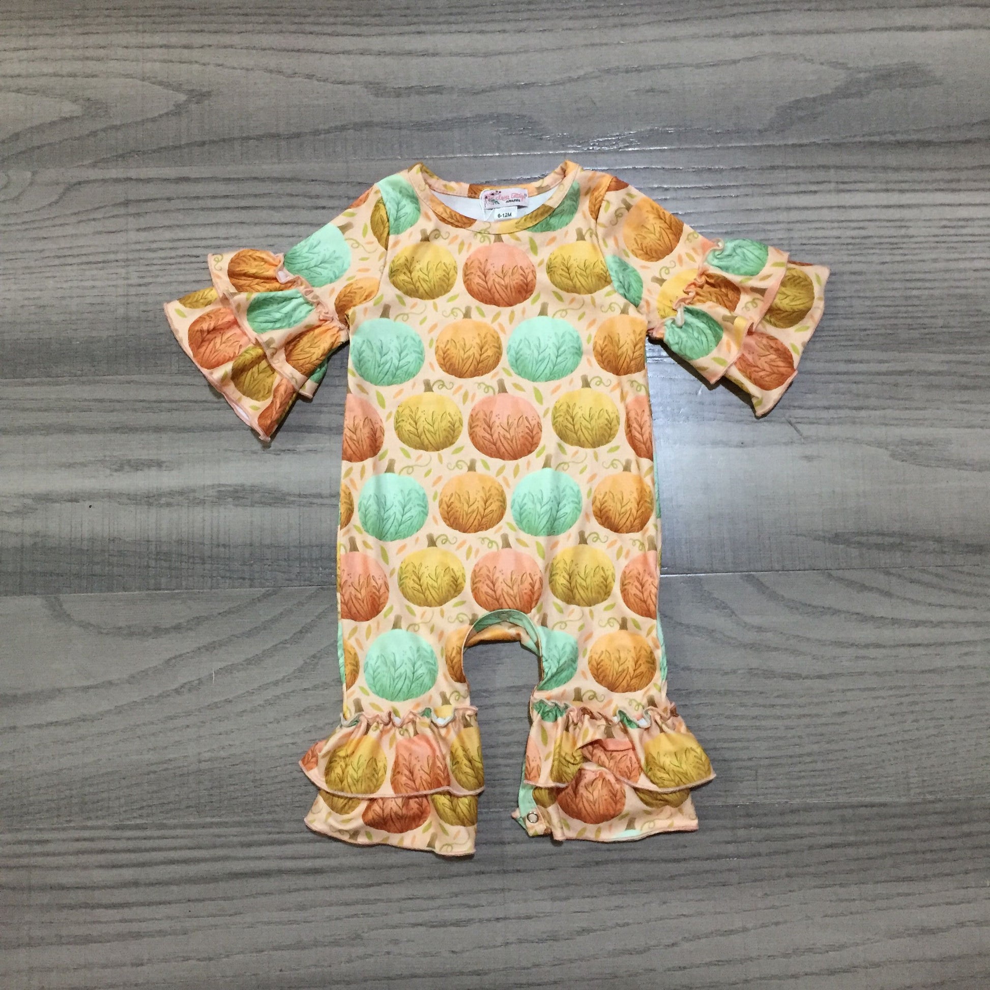 This Fancy-Fall Infant Girl's Romper is sure to have your little pumpkin looking stylish this season! The vibrant multi-color pumpkin print is perfect for the changing autumn weather, and the 3/4 double ruffle sleeve and round neck provide an on-trend look that's sure to turn heads. Perfect for pumpkin-patch photoshoots or playdates in the park - just don't forget to take a pic! 🎃