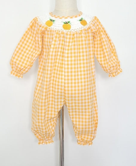 This Pumpkin Smocked Baby Girl Romper is perfect for the season! Made from orange and white gingham print, it features smocking on the neck with darling embroidered pumpkins 🎃 for a classic look. Super stylish and cute!