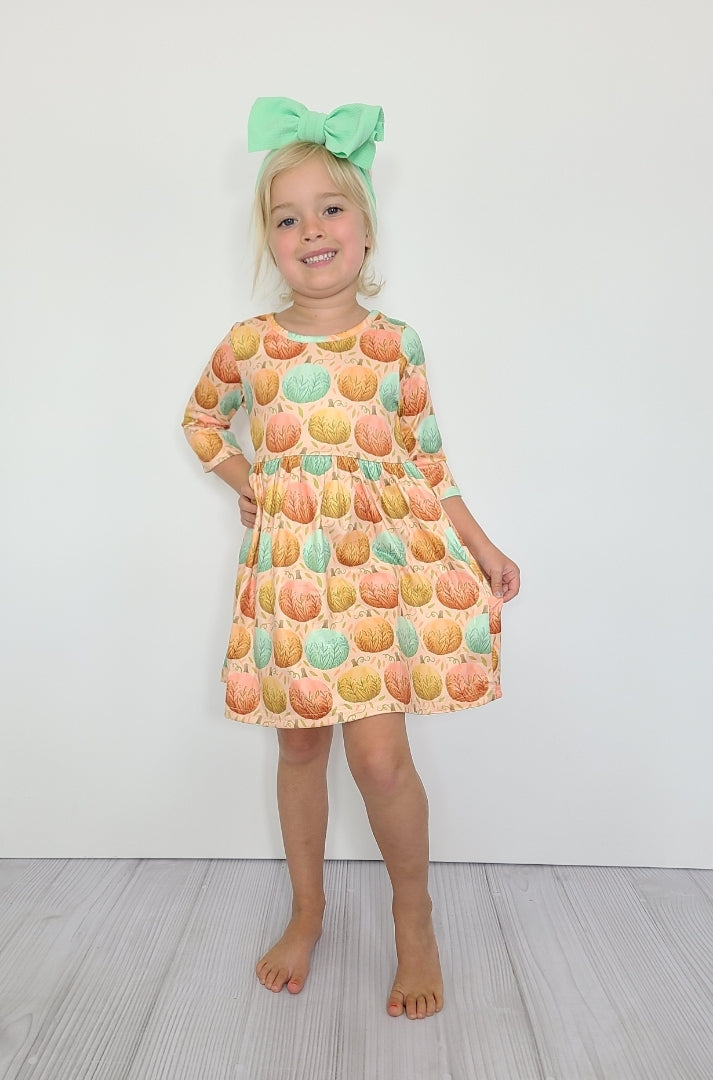 This Fancy Fall Pumpkin Dress is perfect for the changing season! Its beautiful multi-color pumpkin print, 3/4 sleeve, and round neck provide a stylish look that will have you standing out from the crowd. 🎃