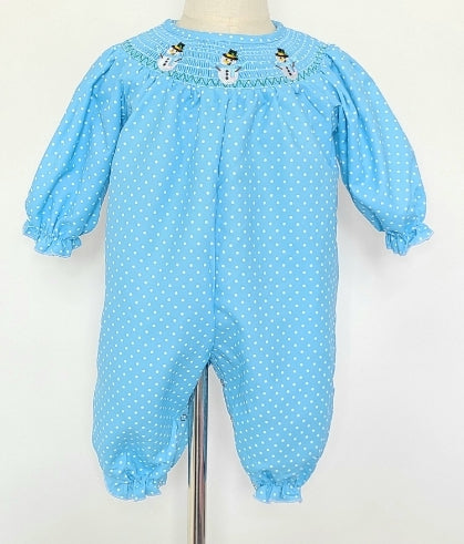 Be the cutest snow-babe around in this super cute Smocked Romper! Featuring an adorable snowman smocking around the neck, plus long sleeves with elastic ruffles at the wrists and ankles, it'll take you from snow day to 🎄 in style! The beautiful blue print with white dots is so on-point, you won't want to flake ❄ out on it!