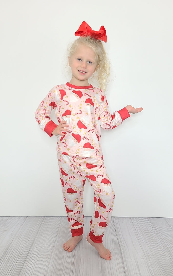 Cozy up in this Candy Cane Loungewear - perfect for all your holiday festivities! Super soft and comfortable, this pajama set features a cute printed design of Santa and candy canes. Get your merriest winter style on with this adorable loungewear - 'tis the season!