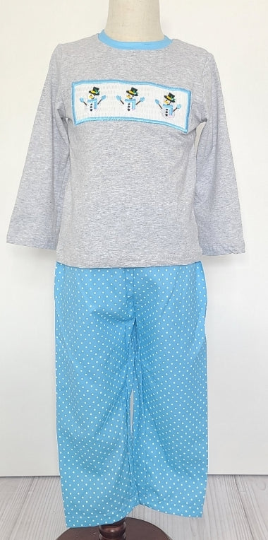 Look snow-cute in this Snowman Smocked 2-piece pant set - The light grey long sleeve shirt is made extra festive with a smocked snowman applique on the chest🤩! The cheerful blue print pant is dotted with white, just like a winter's dream ☃️. Get ready to snow-off your winter style in this one! 