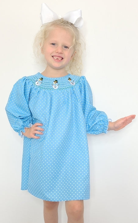 Look snow-cute in this Snowman Smocked Polka Dot Dress - made extra festive with a smocked neckline and snowman appliques 🤩! The cheerful blue print is dotted with white, just like a winter's dream ☃️. Get ready to snow-off your winter style in this one! 💃