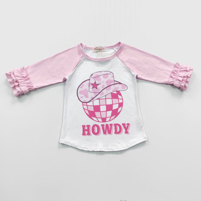 Yeehaw! Make a statement at the rodeo in our Pretty in Pink-Howdy Raglan! Featuring an adorable double ruffle sleeve, a sweet little cowboy hat with pink and white cow print, and a classic, pink-on-pink "HOWDY" - you can be sure you'll stand out! Gallop on in and get yours today!