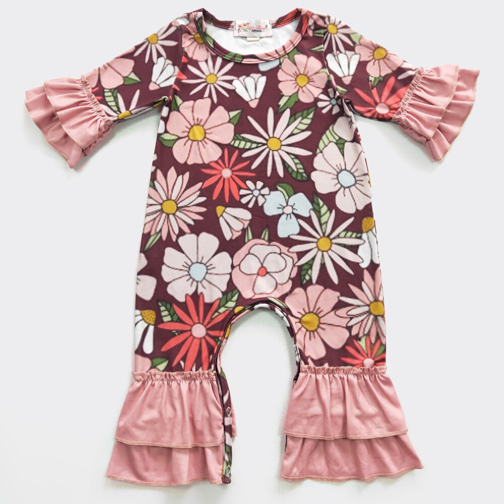 This Garnet Blooms Girl's Romper is the perfect way for your little one to let her inner flower show! With a beautiful large floral print and super sweet double ruffles on both sleeve and leg, she'll be blooming - and turnin' heads - all day!