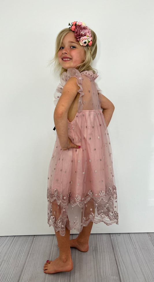 This mid calf length dusty mauve tulle and lace dress is so pretty, it'll have her tulle-ing around with joy! With coquettish lace and soft mauve tulle, plus ruffled flutter sleeves, she'll be the hautest girl in town! Go girl! 