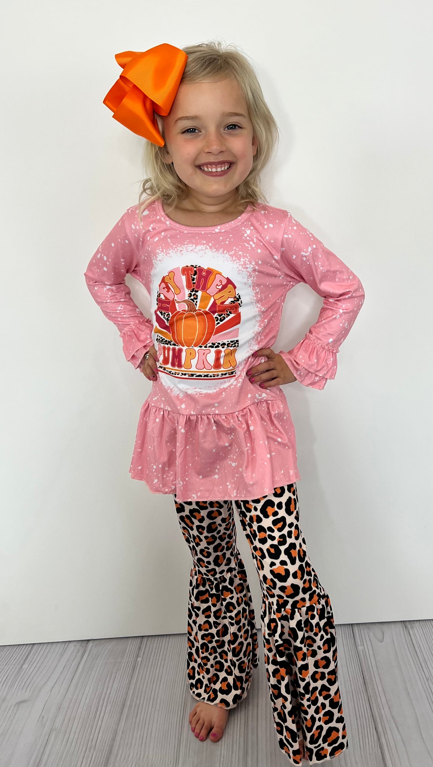 This fabulous two-piece boutique set features an adorable pink top with "Hey there pumpkin!" graphic as well as double ruffle at wrist and large ruffle bottom. The leopard print bell bottom pants will have your princess ready for any occasion. So get ready to ooh and aah, 'cause she'll be lookin' too cute!