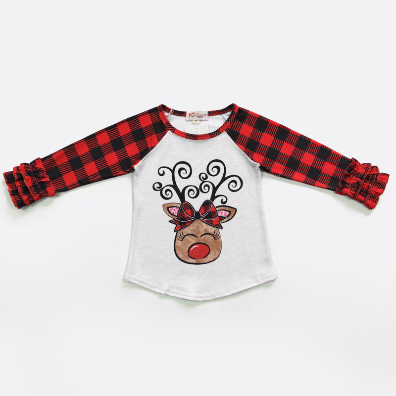 Step up your holiday style game with this spunky, Reindeer Girl Ruffled Raglan Shirt! Stand out from the pack with a buffalo plaid sleeve and a playful reindeer image complete with a buffalo plaid bow. Score major style points in jeans, a skirt or shorts--you can't go wrong!