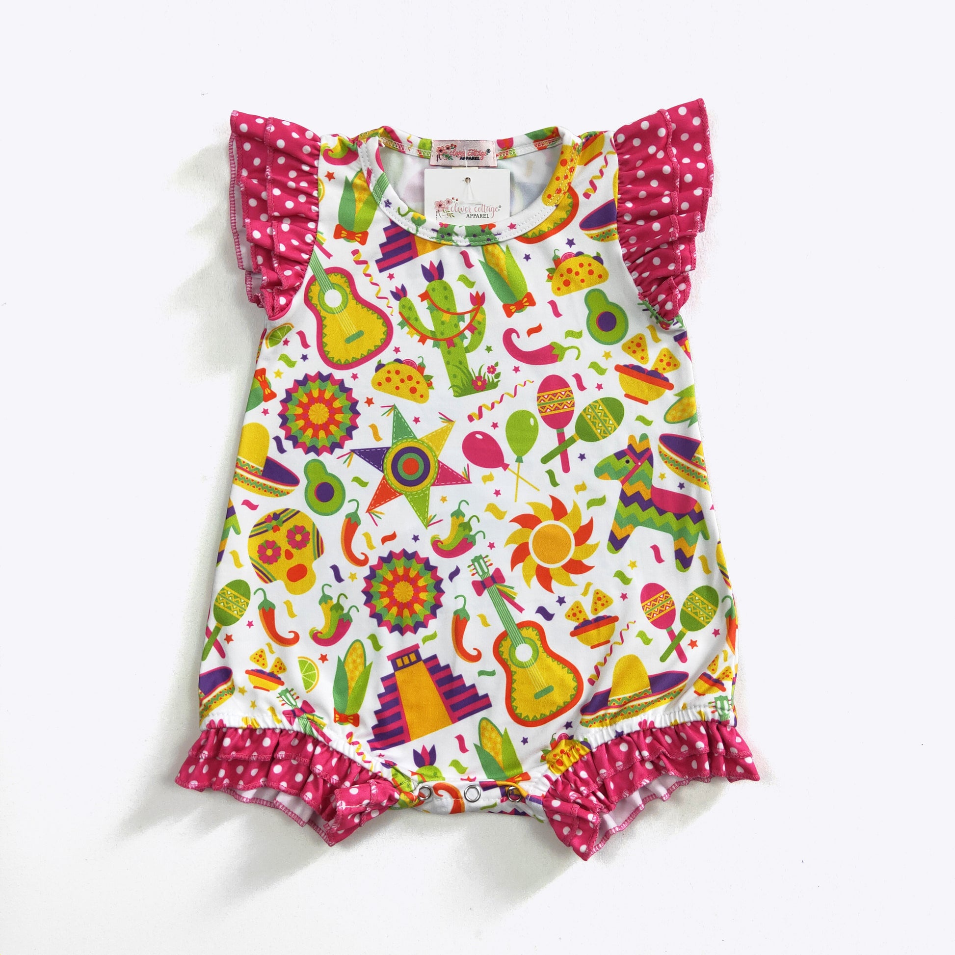 Get ready to fiesta with this playful and vibrant infant girl's shorty romper! Featuring a fun fiesta print and hot pink polka dot fabrics, this romper will have your little one looking adorable. With flutter ruffle sleeves and legs, and a convenient snap crotch, this romper is perfect for any fiesta-loving baby.