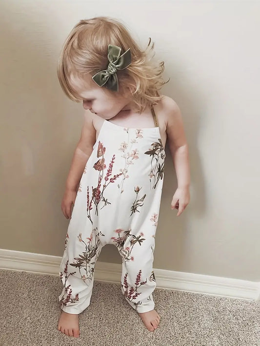 This floral cutie is the perfect mix of style and comfort! You'll love its halter style and open back, and the long pant bottoms provide super coziness for all your summer activities. Ready for a day of fun? This is absolutely adorable for the occasion!