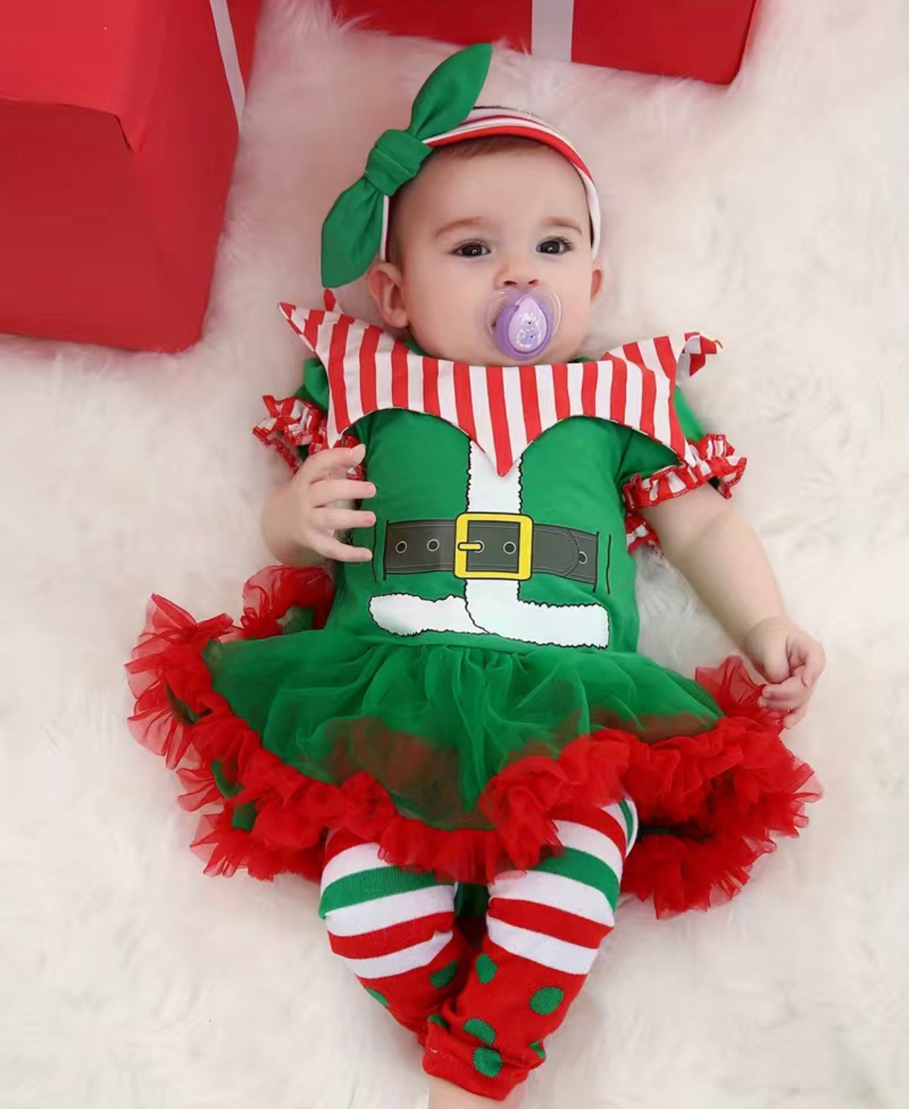 Awww, so cute! Get your little elf looking festive and fun with this Elf-Fun Adorable 3-piece set! This adorable outfit includes a onesie-style elf tulle dress, matching thigh-high socks, and a coordinating headband. Have your sweetie stand out this holiday season with this festive and cute ensemble! Let the merry-making begin!