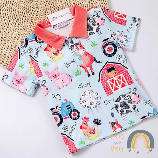 This Farm Life Boys short sleeve shirt is a great way to let your little one make a big statement! Featuring an adorably printed fabric with a farmyard-ful of critters and a barn, this collared top is an ideal way for your mini-farmer to show off their style! Super soft milk-silk fabric. Check out our additional sibling outfits in the Farm Life series.