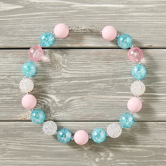 Complete the look with one of our Bubble Gum Necklaces — a chunky 18" of fun your kid won't be able to resist! With a clasp for easy closure and beads that look good enough to eat (but don't!), it's the perfect accessory for any kiddo!