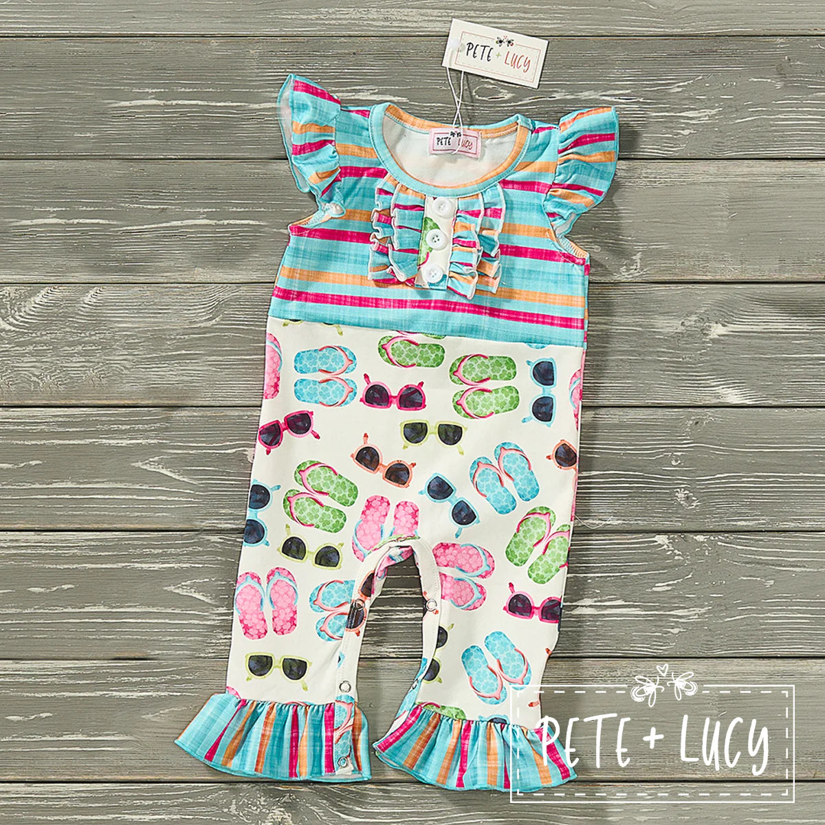 Your little cutie is ready to rock the streets in this adorably stylish Flip-Flop Romper! With its jewel neckline, flutter sleeves, and an adorable ruffle & button accent, she'll be the coolest one around! Make sure she looks sun-sassy in this one-piece wonder - summers never looked so good!