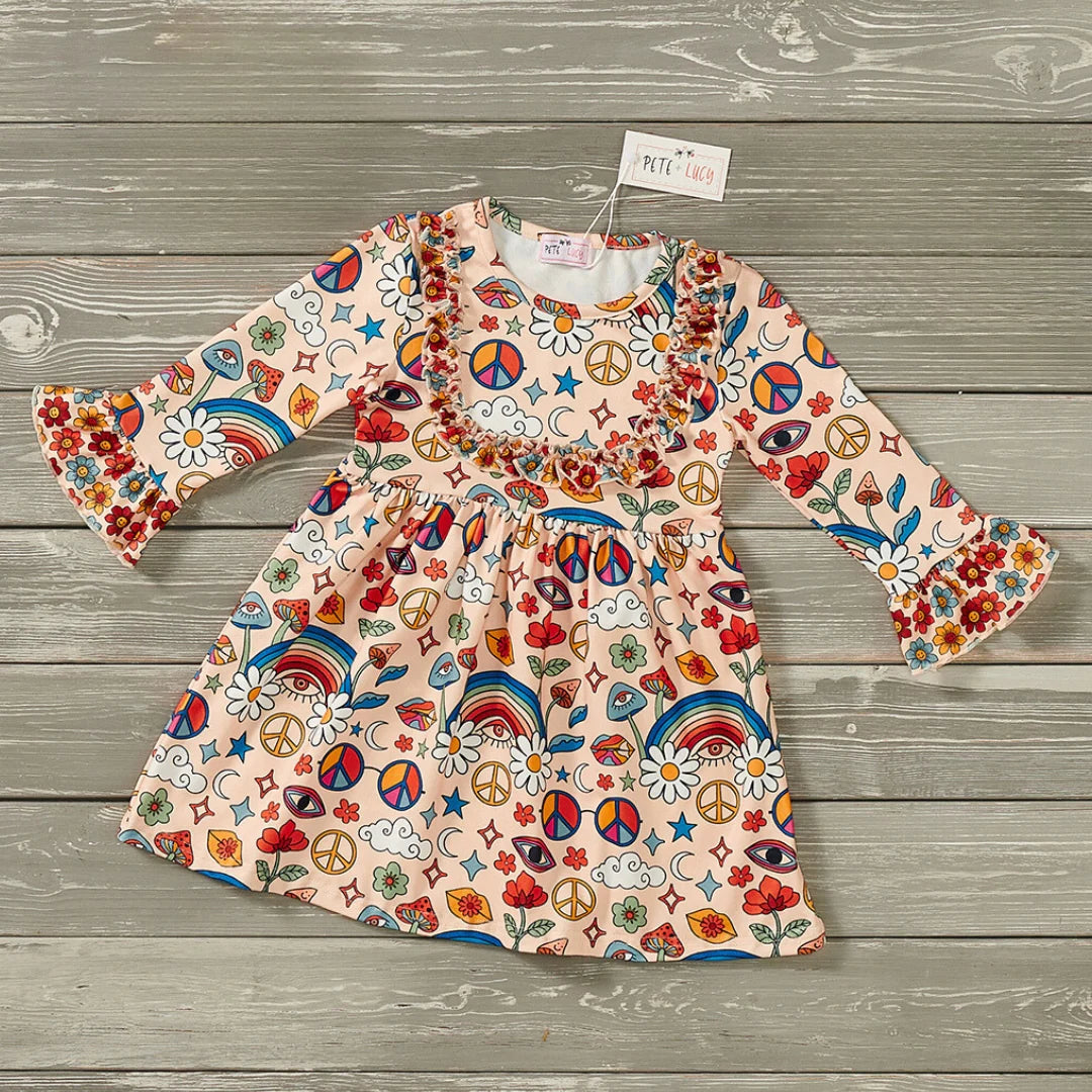 Feel groovy in this Flower Child Print Dress! It features colorful peace signs, rainbows, and flowers, and comes with a jewel neckline, long sleeves, and ruffle accents. You'll be in a summery state of bliss mood with this fun and festive style!