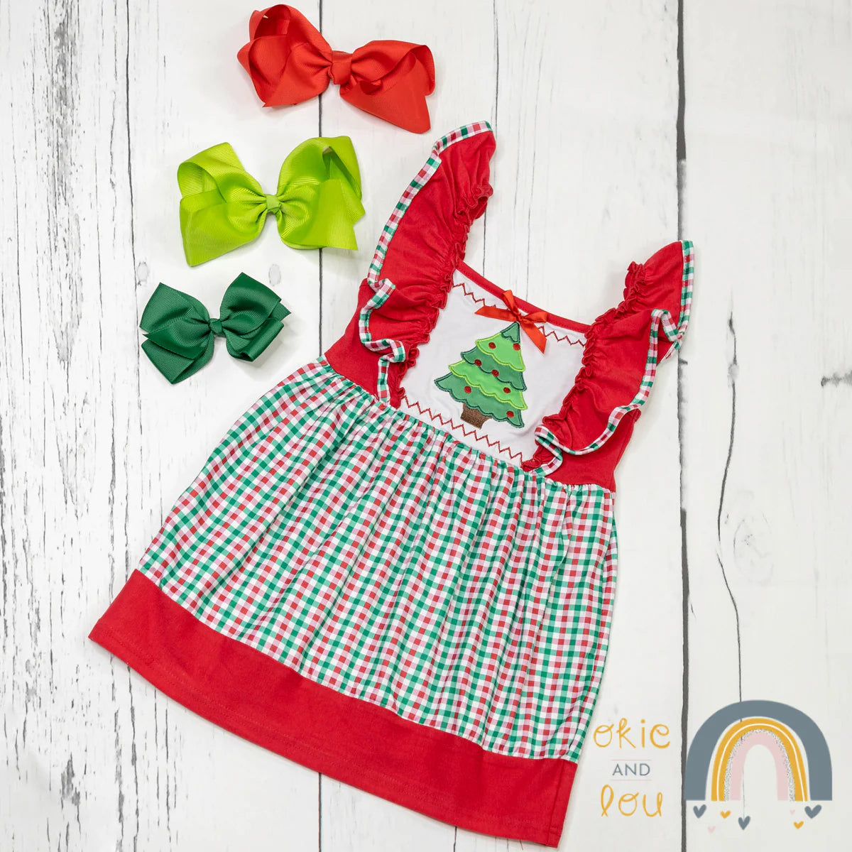 This Holiday Gingham Ruffle Sleeve Dress is the perfect way to spread festive cheer! With a darling ruffled sleeve and a holiday-inspired decoration on the chest, this dress looks uber-adorable. Plus, the red, white, and green gingham skirt will have you feeling like you stepped out of a holiday storybook! Get into the spirit of the season with this exciting dress! Check out the matching sibling sets!