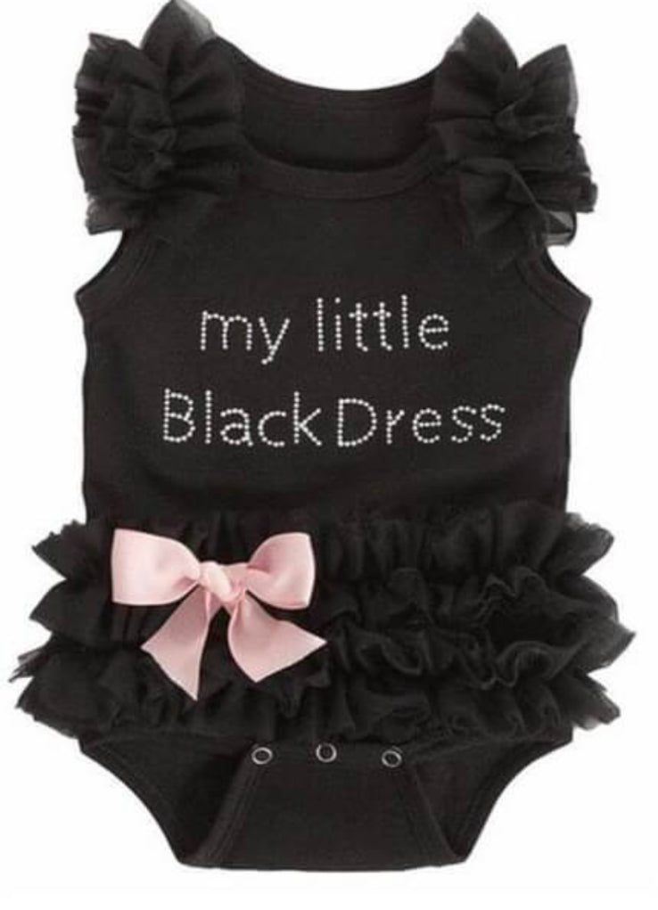 This "My Little Black Dress" romper is a must-have for your little fashionista. Featuring a black onesie with delicate lace ruffles, a pink satin bow and a playful "my Little black dress" slogan in tiny rhinestones, this outfit is both stylish and comfortable. Plus, the snap crotch makes diaper changes a breeze. Dress your baby in style with this adorable romper!