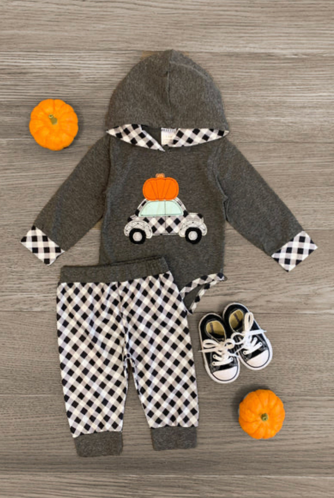 Outfit your little one for adventurous fall days with this Carload of Pumpkin fun-2 piece Hoodie outfit! From its cozy hoodie onesie with an adorable applique to the matching checkered pants, this outfit is perfect for a day of apple picking, hayrides, and more! And don't forget the sweet details like the contrasting ankle and waist fabric on the pants and checkered pattern on the hood and cuffs. Hop in and get ready for a carload of pumpkin fun! 🚗☀️