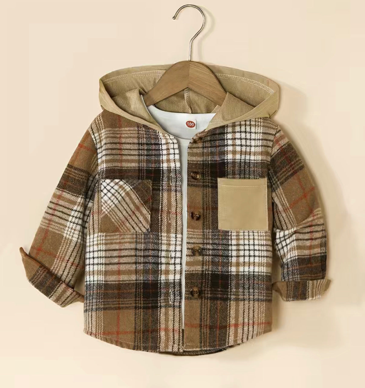 This Plaid Hooded Long Sleeve Shirt/Jacket is a wardrobe saviour! With its cozy flannel hoodie, two convenient front pockets, and button-down front, you'll stay lookin' cool while stayin' toasty warm. A match made in heaven!