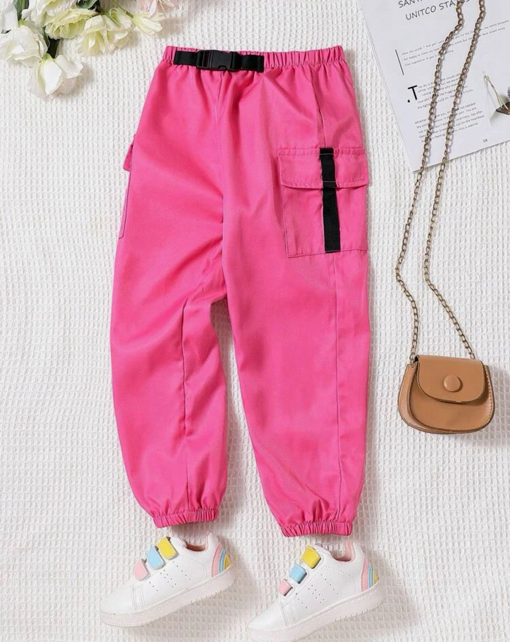 Look cool *and* cute in these Hotter-in-Pink Cargo Pants! With a buckle detail belt, comfy elastic waist and hem, as well sassy flap pockets to boot, you'll be channeling your inner Barbie with style!