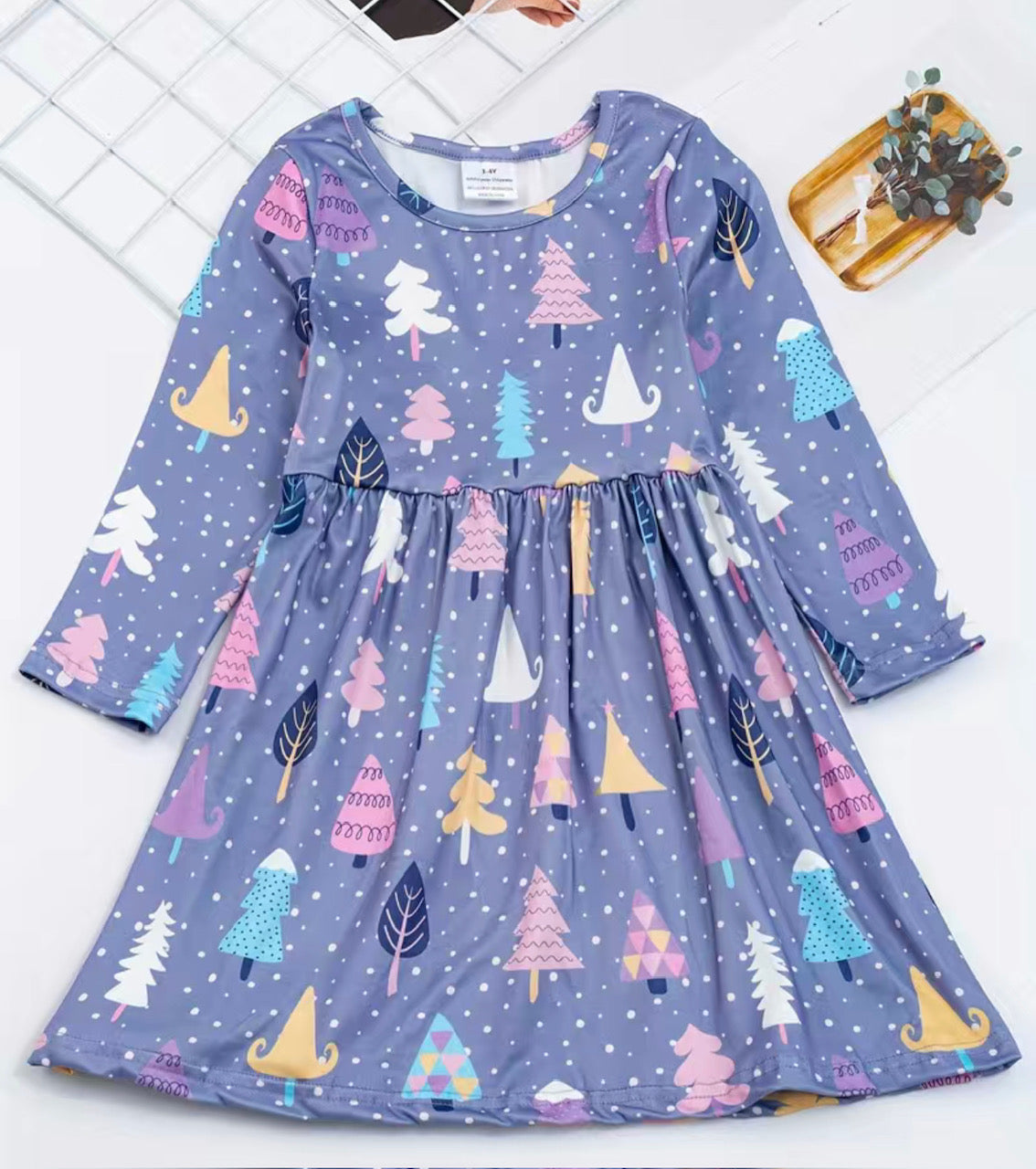 Fill your wardrobe with a touch of winter cheer! This Colorful Winter Trees Girls Dress has a fun, vibrant look and is adorned with a purple background and colorful winter trees. Crafted from ultra-soft milk silk fabric in a 3/4 sleeve, rounded neck A-line cut, it's perfect for twirling and dancing! (And looking good doing it!) 🎄