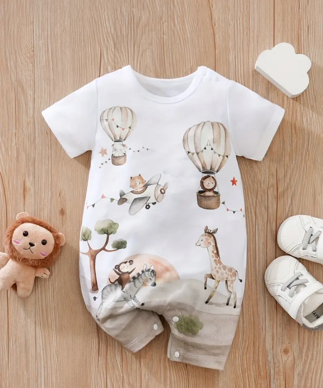 Hit the ground running with this Animal Adventure Shorty Romper! Featuring a rounded neck and snap closure for easy on and off, this romper is perfect for little ones on the move. With short sleeves and an adorable multi-animal print, your little explorer will be the talk of the town. (No need to tell them how convenient it is for diaper changes!)🐒🦒🦁🦓
