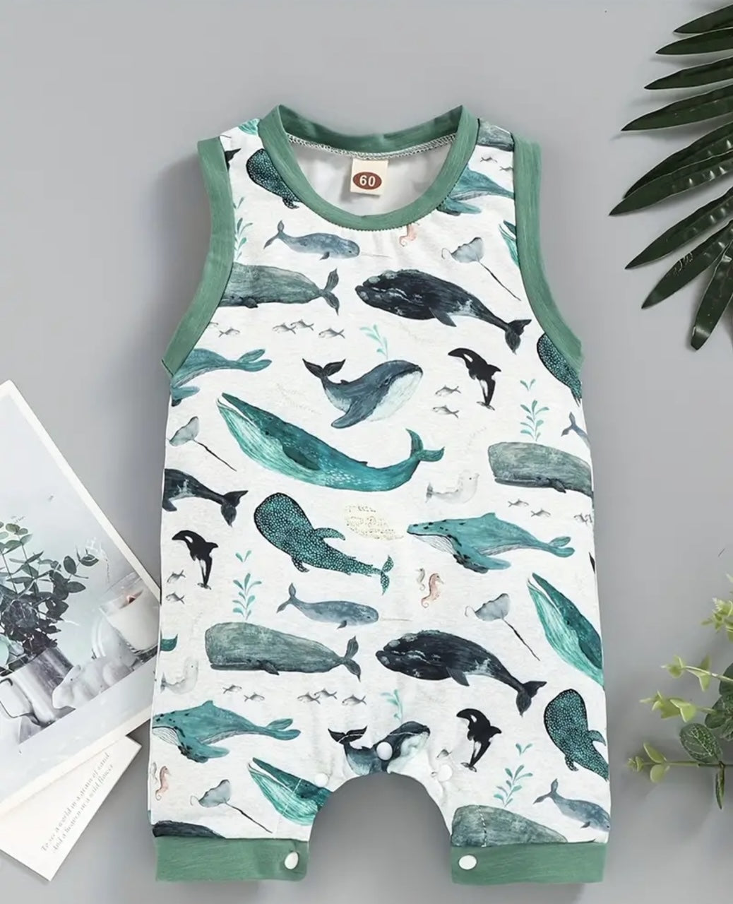 Dive into a Whale of a Time with this sleeveless shorty romper! Featuring an adorable multi whale print fabric, ribbed hem and neckline, and easy snap closure. Perfect for your little one's playful adventures.🐳💙