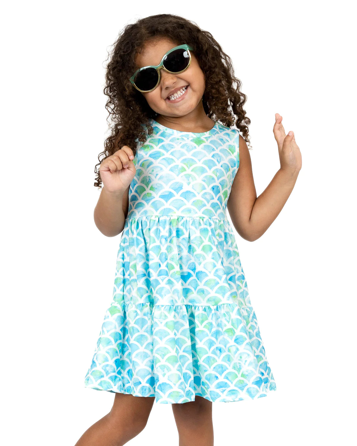 Look out of this world in this gorgeous Marvelous Mermaid dress! You'll be the center of attention with its beautiful mermaid scale print in hues of blue and green, and jewel neckline. The sleeveless design and A-line cut will take you from brunch to beach with ease! Dive into this fashion-forward look!