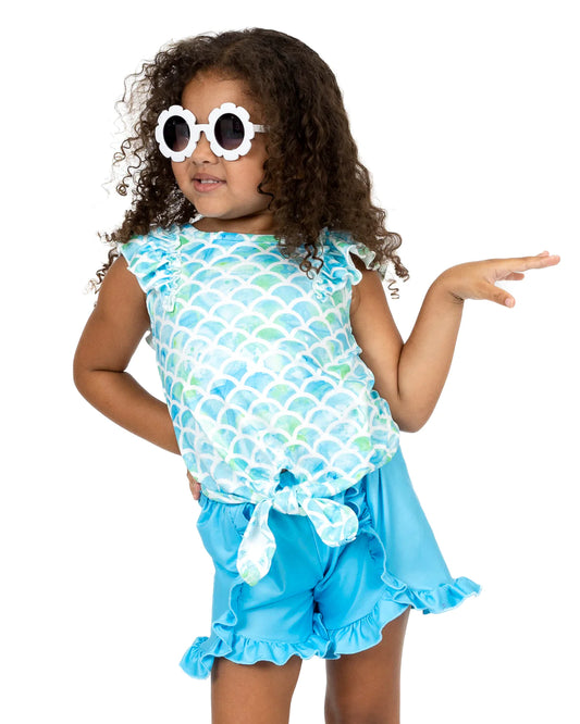 Dive into this Marvelous Mermaid Short Set and you'll be feeling like a real sea siren! From the jewel neckline and flutter sleeves to the garterized waist and ruffle hems, this set's got all the magical, mermaidy ingredients to make you feel like you're part of the ocean. Plus, its beautiful blue and green hues bring out your inner goddess. You'll be the real catch of the day!