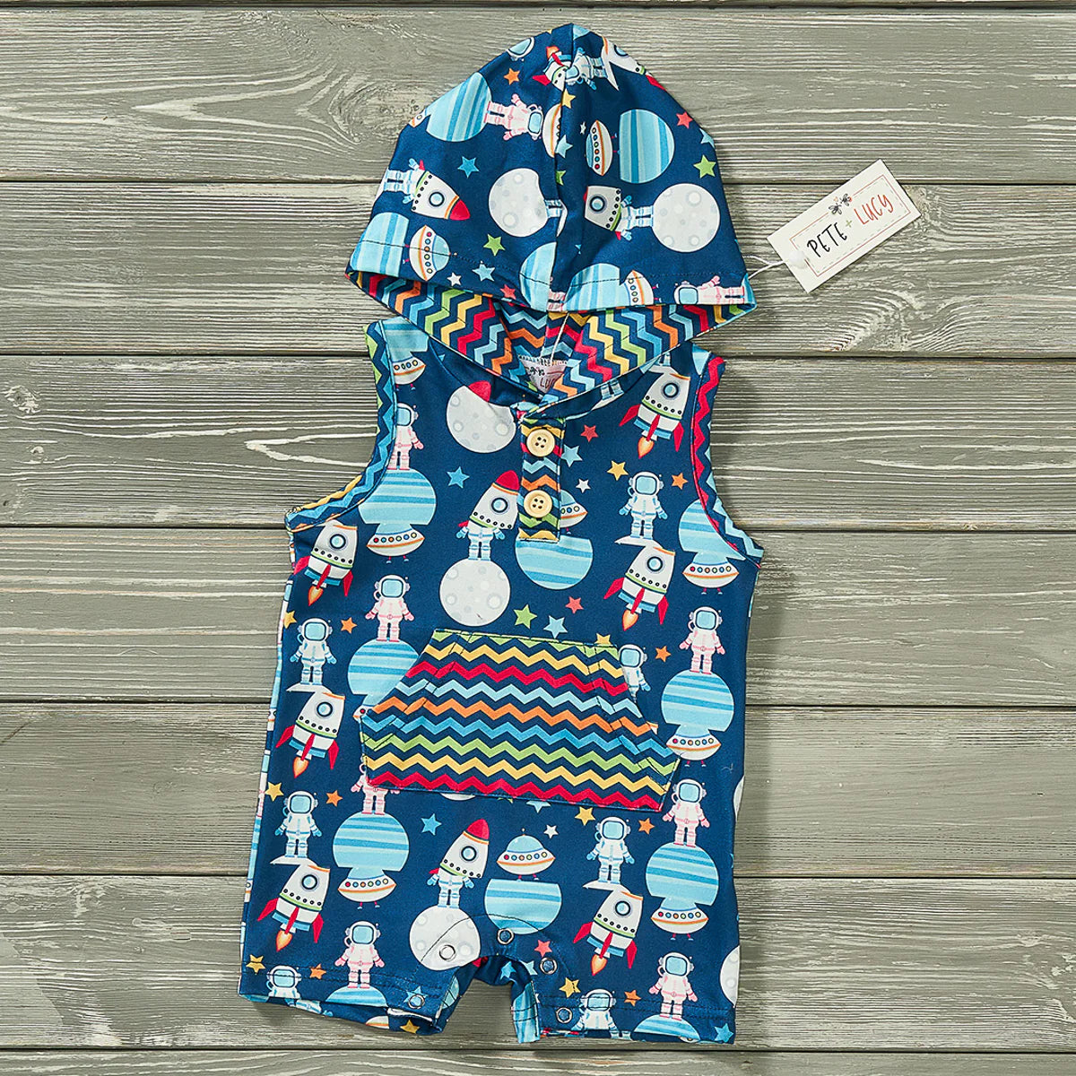 This Alien and Friends Boy's Infant Romper is perfect for your little explorer. This shortie romper features an outer space inspired print, a hooded design, buttoned closure, and sleeveless cut. Plus, it has a multi-color zig zag kangaroo pocket and snap up closure for ease of use.