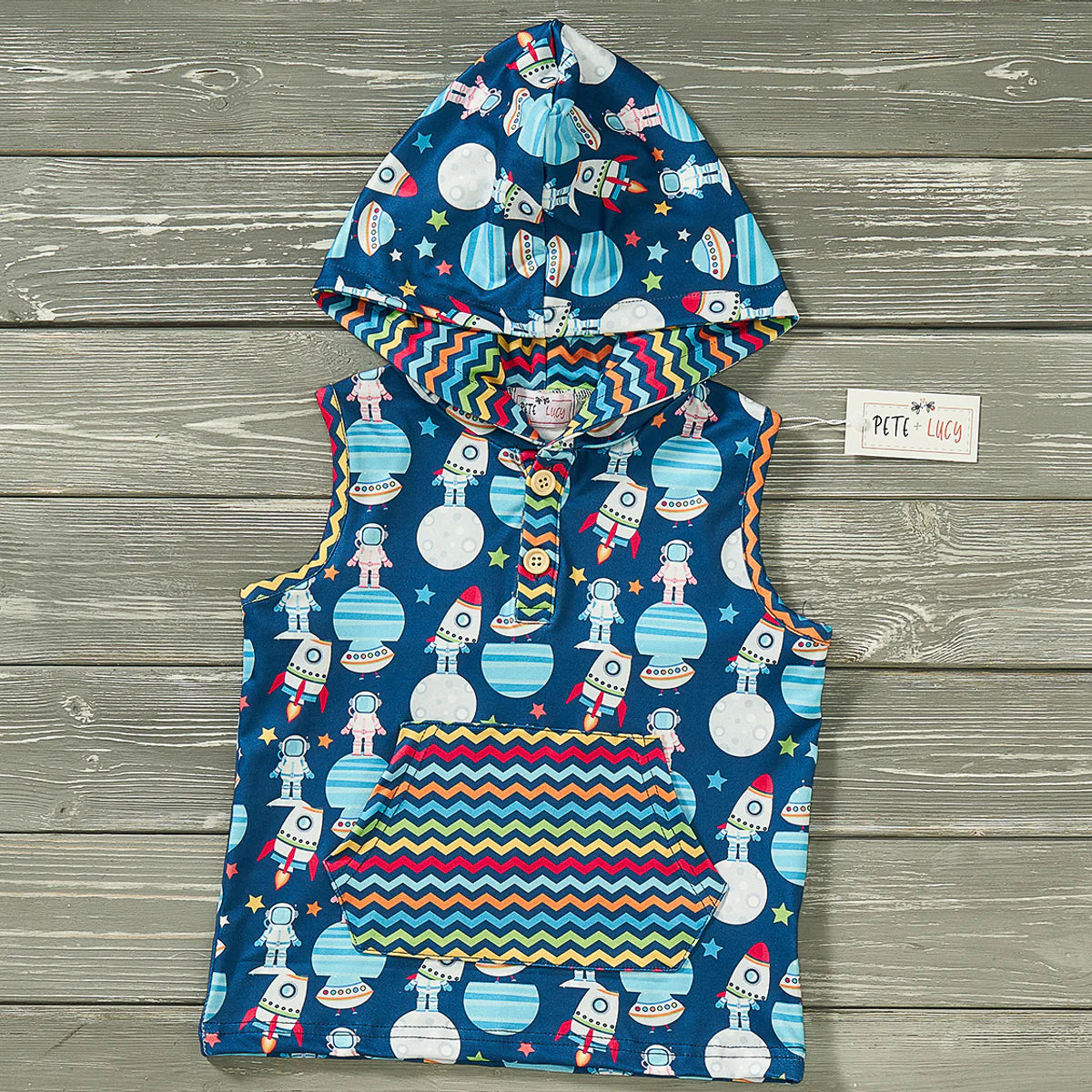 Outer space never looked this comfortable! Our Aliens and Friends Sleeveless Hooded Shirt is out of this world - literally! Featuring a super cute sleeveless design and a multi-colored zig zag print on the kangaroo pocket, this shirt is sure to make you the star of the show. Plus, it has a hood - what more could you ask for? Aliens ahoy!