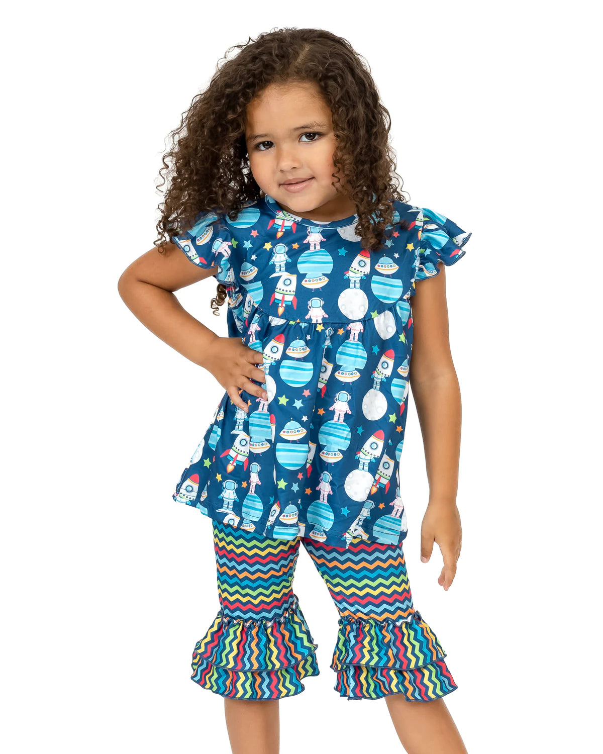 Blast off in our Aliens and Friends 2-piece capri set! Featuring an outer space-inspired design, The jewel neckline and flutter sleeves are on point on this tunic style top. The multi-color zig-zag print bottom with double ruffle completes the set; It is out of this world, literally! Perfect for the little astronaut in your life! Whoosh!