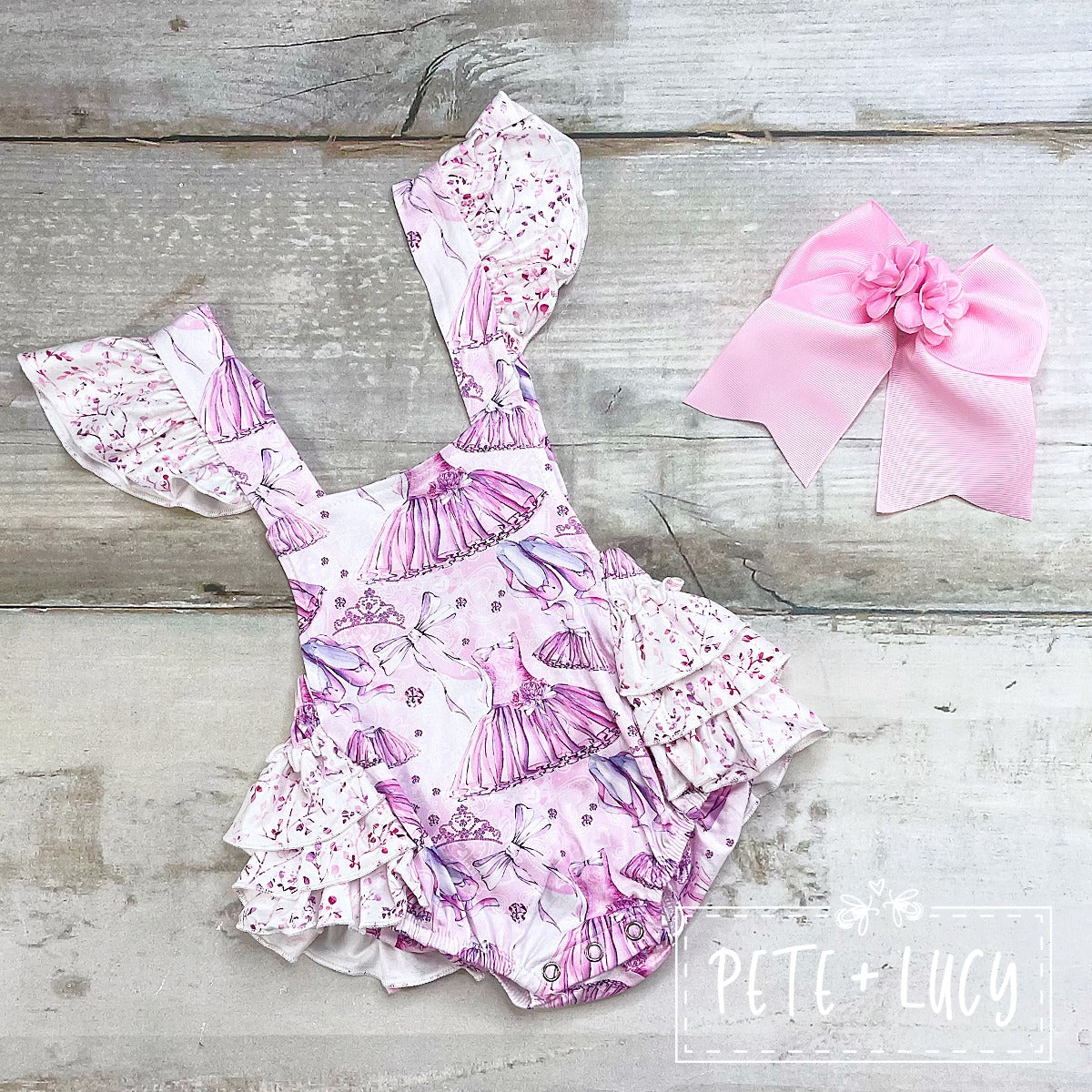 Make your little princess the star of the show with this fabulous Princess Dancer Girls Halter Romper! Featuring a dreamy pattern and a triple ruffle bottom that's sure to have her twirling in delight, she'll make a statement (and some moves) in this halter style must-have. Dance like no one is watching!