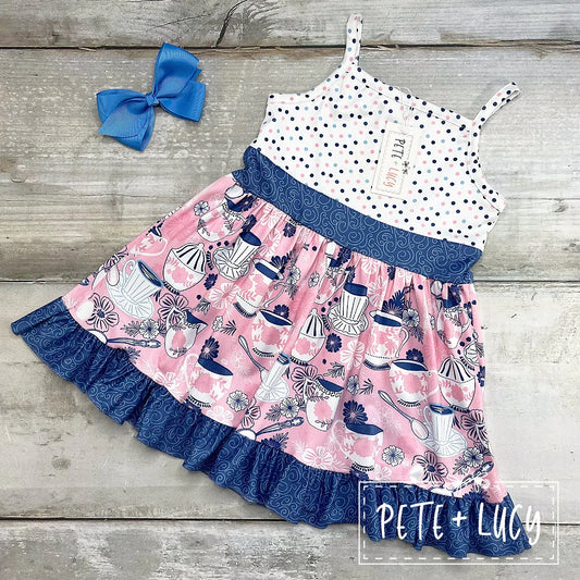Step back in time with our Vintage Tea Dress! Flattering spaghetti straps, a perfectly pinched A-line, and ruffled hem – see if you can resist its charms! Not to mention the fun multi-patterned design that says oh so chic without saying a word. Perfect for a garden party,  or a Sunday tea with the gals!