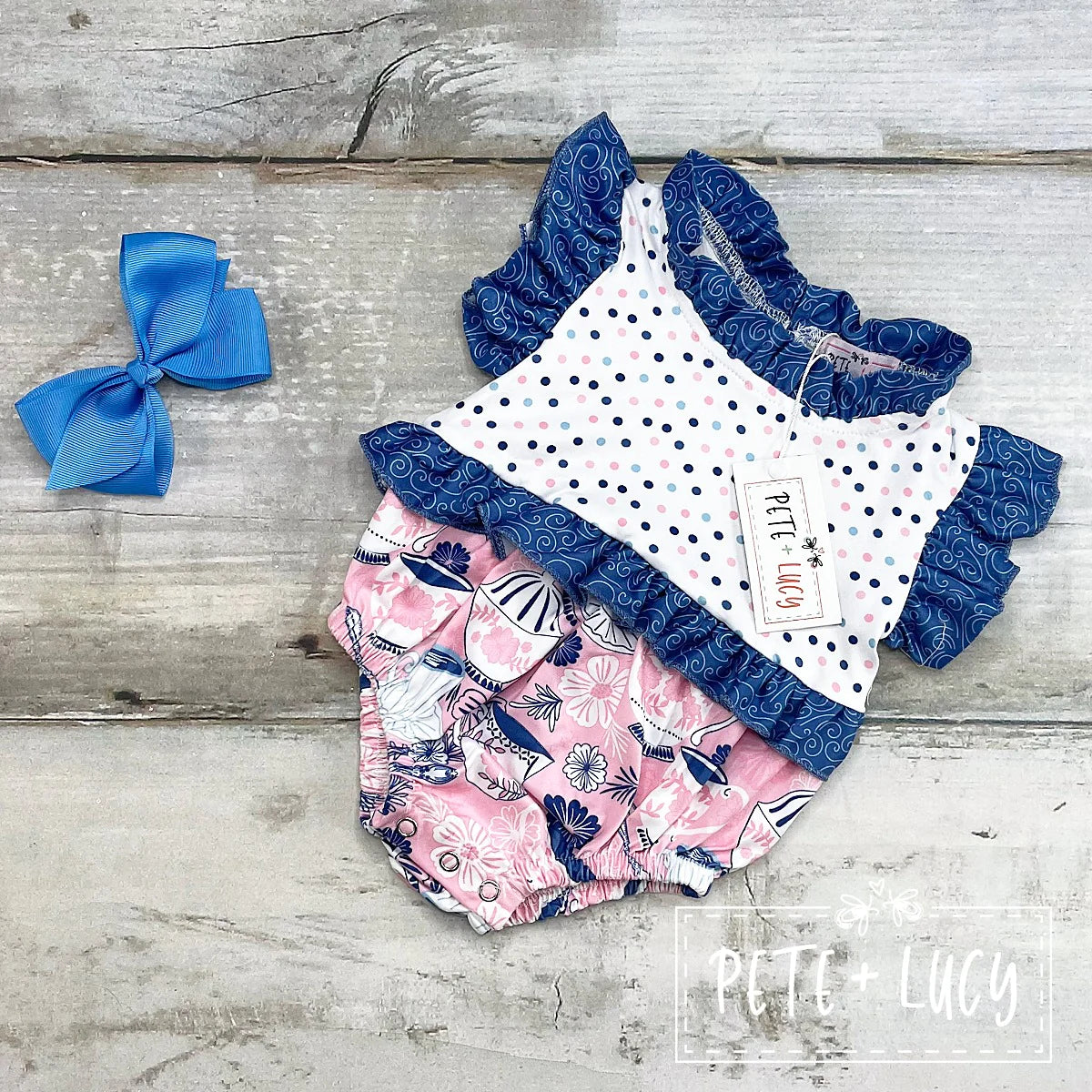 Send your little girl back in time with this Vintage Tea Girl's Bubble Romper! With its classic-style (polka dot, swirl and vintage tea pattern designs) as well as delightful ruffles all around, she'll feel like a true vintage tea party princess! Plus, with an adorable sibling set available, there'll be no rivalry between siblings over who looks cuter. Time for tea!