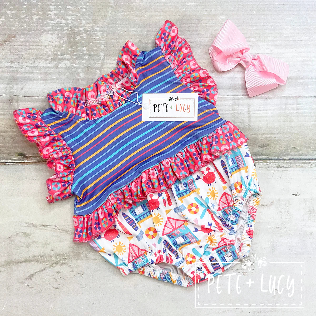 Welcome the warm weather in style with the Beach Days Bubble Romper! This precious little outfit is made with super soft milk silk and features an absolutely adorable multi-print fabric. It also has small ruffles at the sleeve, neck and waist, making it as cute as can be! Get ready for your little one to be the cutest this summer!