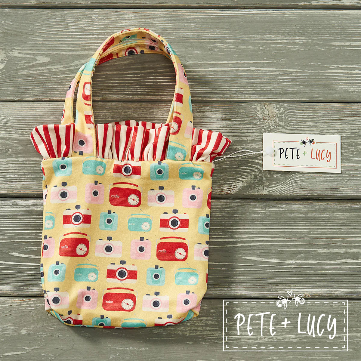 These Bucket Purses feature the prints of their matching collections. They measure 8 inches by 7 inches and the strap is 9 1/2 inches attached end to end. Perfect for all your fashion adventures! Check out all of the matching sibling and Dolly sets.