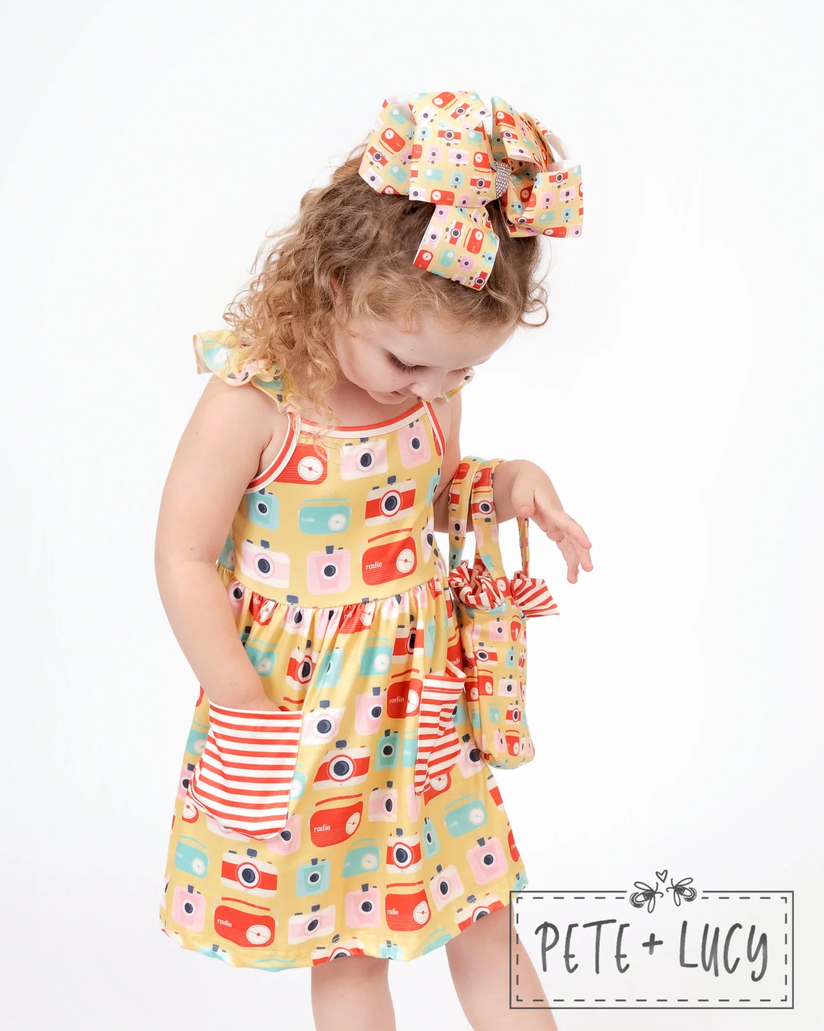 Look sweet and summer-ready in this Retro Summer Sleeveless Dress! With its cute combo of vintage camera/radio prints and red and white stripes, you'll be ready for anything that comes your way. A Jewel Neckline, Flutter Strap Sleeves, A-line Cut, and adorable pockets will have you feeling totally stylish! Let's get retro!