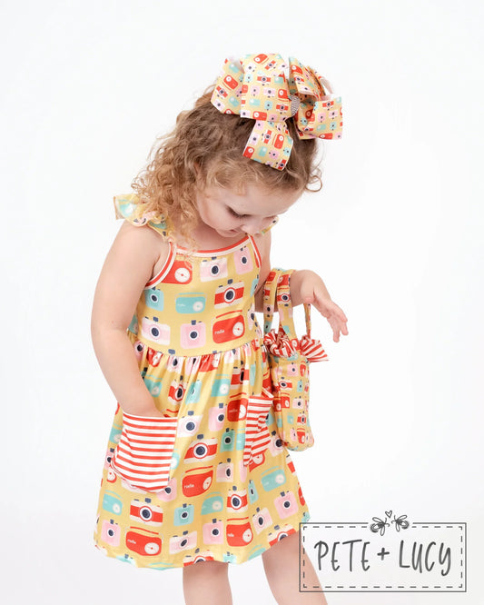 Look sweet and summer-ready in this Retro Summer Sleeveless Dress! With its cute combo of vintage camera/radio prints and red and white stripes, you'll be ready for anything that comes your way. A Jewel Neckline, Flutter Strap Sleeves, A-line Cut, and adorable pockets will have you feeling totally stylish! Let's get retro!