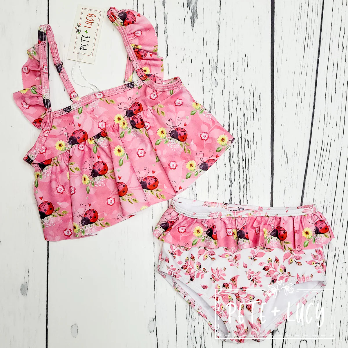 Get ready for some fun in the sun with our Sweet Ladybugs swimsuit! This 2-piece set features an adorable flutter sleeve and loose ruffle top, perfect for splashing around. And did we mention the cute ladybug print? This swimsuit is a must-have for any beach day👙
