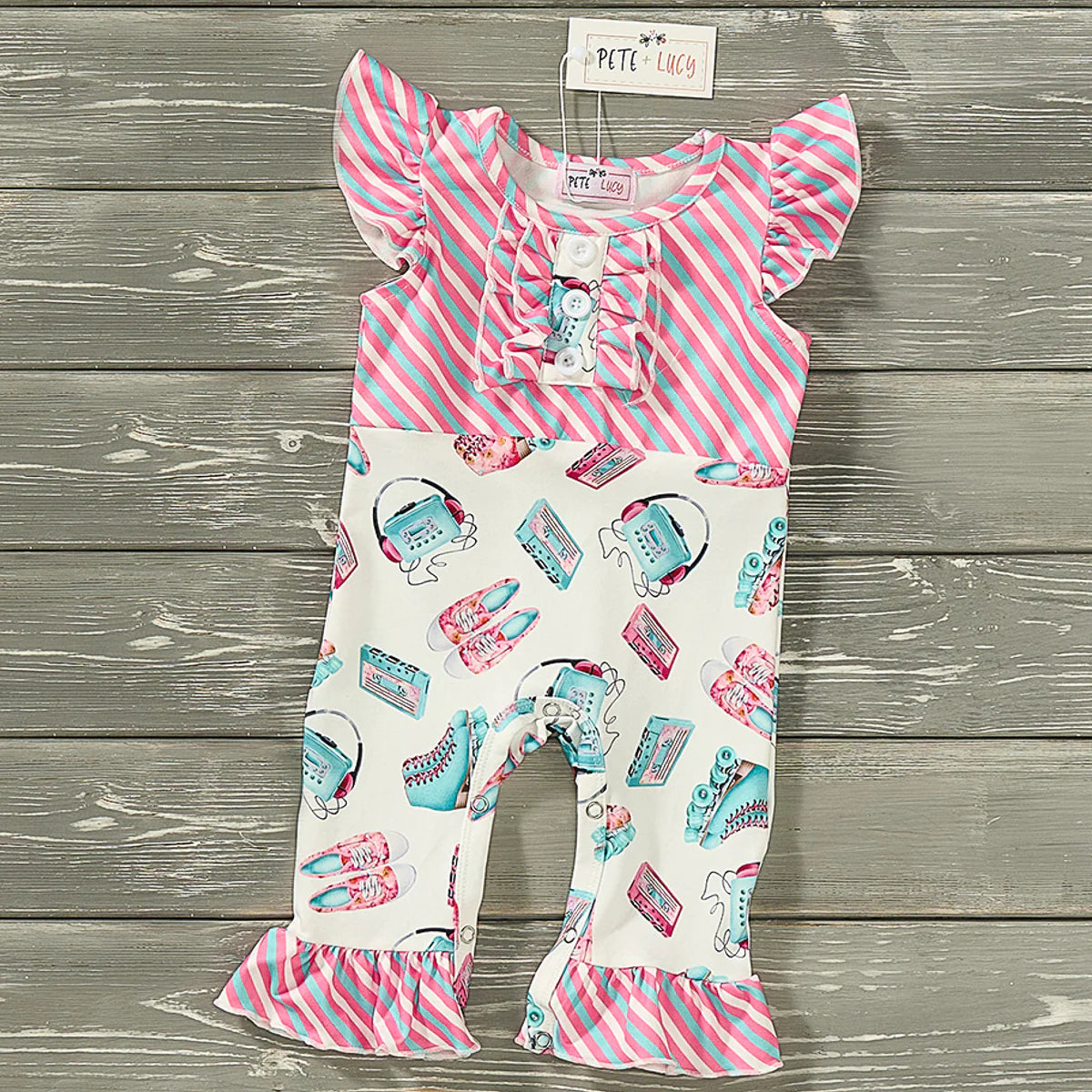 This Skater Girl Infant Romper is the perfect balance of sweet and stylish. Crafted with a vibrant roller skate print and complimenting stripe fabric combo, this romper features a jewel neckline, flutter sleeves, a ruffle and button accent, and a ruffle hem. Plus, it has a convenient snap up closure for easy changing.
