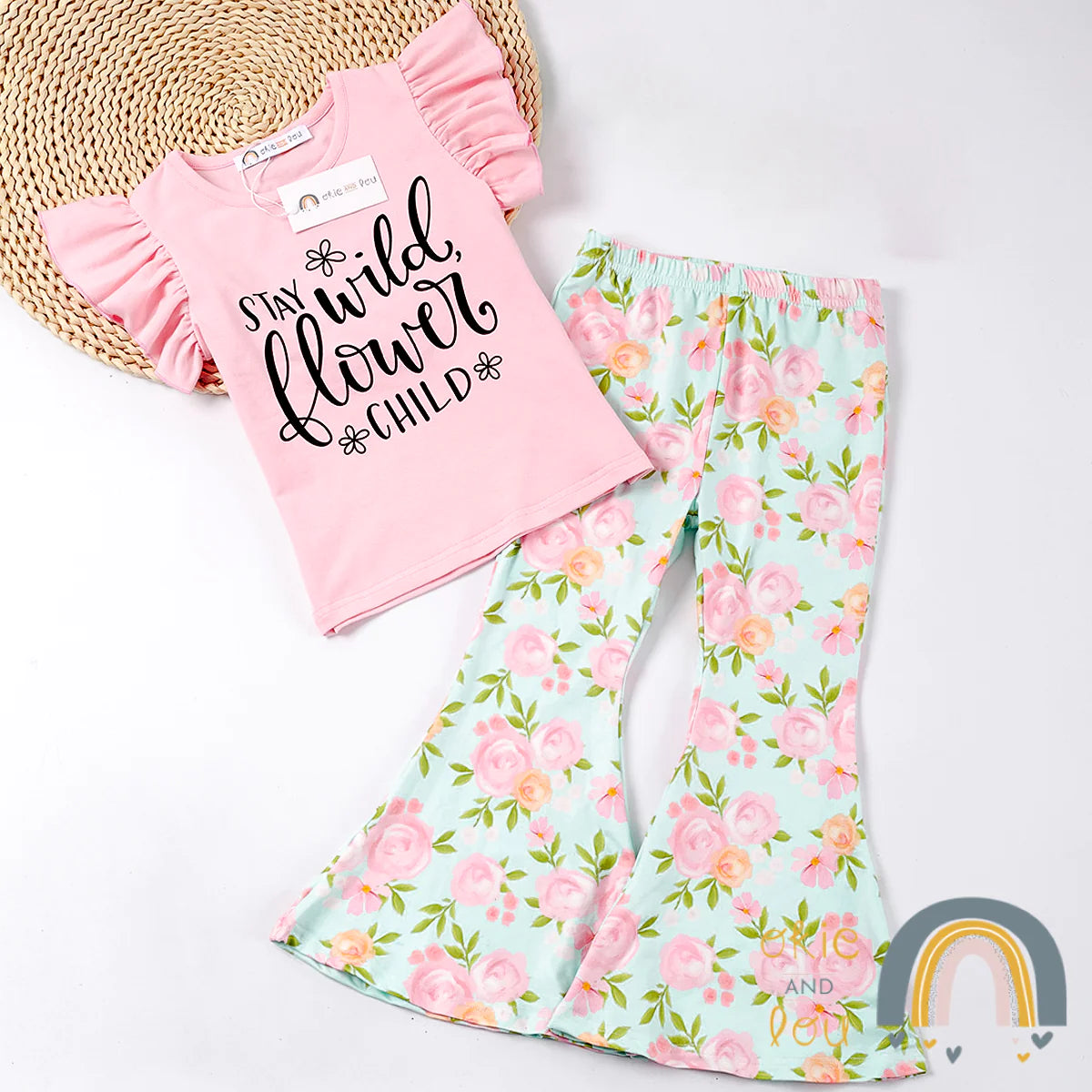 Show your wild, free spirit with the Stay Wild-Flower Child 2 piece Pant Set! Keep it cool and comfy with the graphic pink tee and fabulous floral bell bottoms in a colorful blend of pinks, greens, and aqua. Express yourself in style and flaunt a look that’s totally you! 🌸