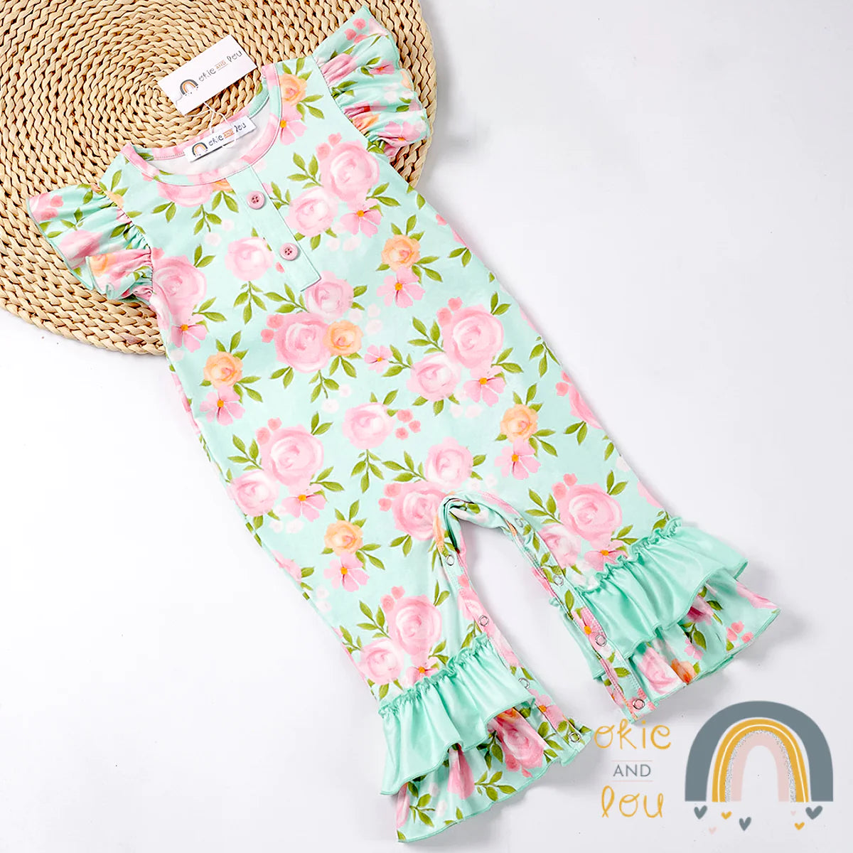 Watch your little one burst into bloom wearing this gorgeous Stay Wild-Flower Child Infant Romper! Featuring a romantic flutter sleeve, and a beautiful floral pattern in enchanting pinks, greens, and aqua, We just love the double ruffle hem! Your little rosebud will be looking as sweet as a wildflower!