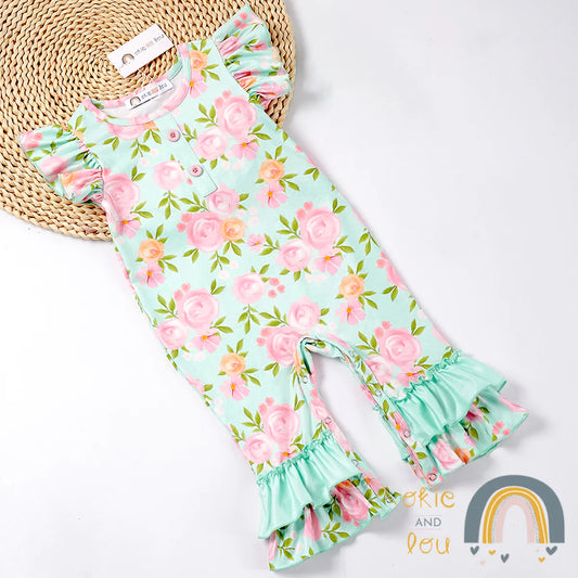 Watch your little one burst into bloom wearing this gorgeous Stay Wild-Flower Child Infant Romper! Featuring a romantic flutter sleeve, and a beautiful floral pattern in enchanting pinks, greens, and aqua, We just love the double ruffle hem! Your little rosebud will be looking as sweet as a wildflower!
